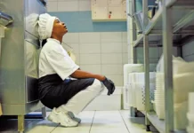 mental health exhausted female cook restaurant kitchen